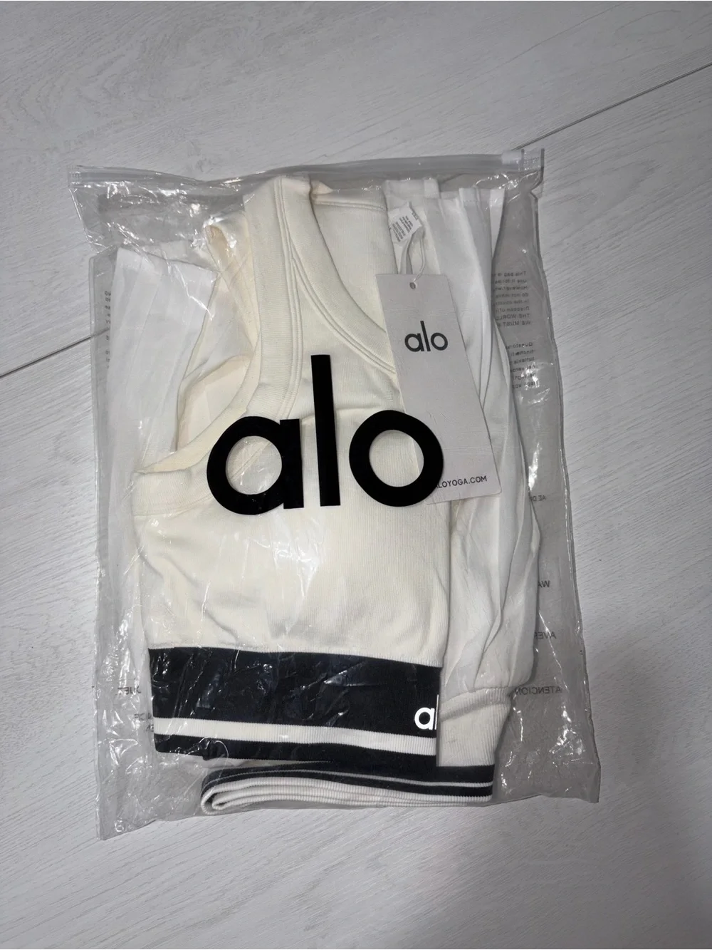 Alo yoga white and black short skirt and top